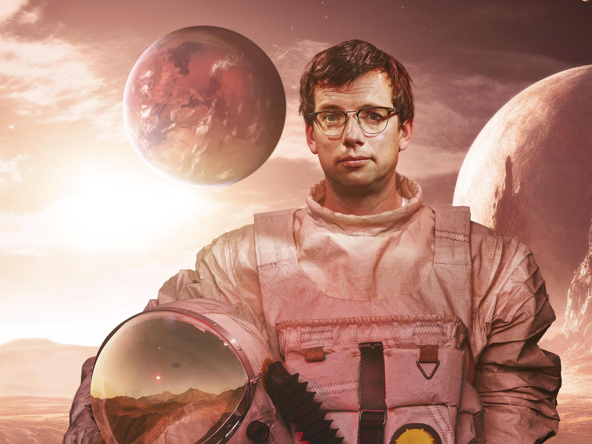 Pieter Derks, Promotiefoto van Pieter in ruimtepak tussen de planeten